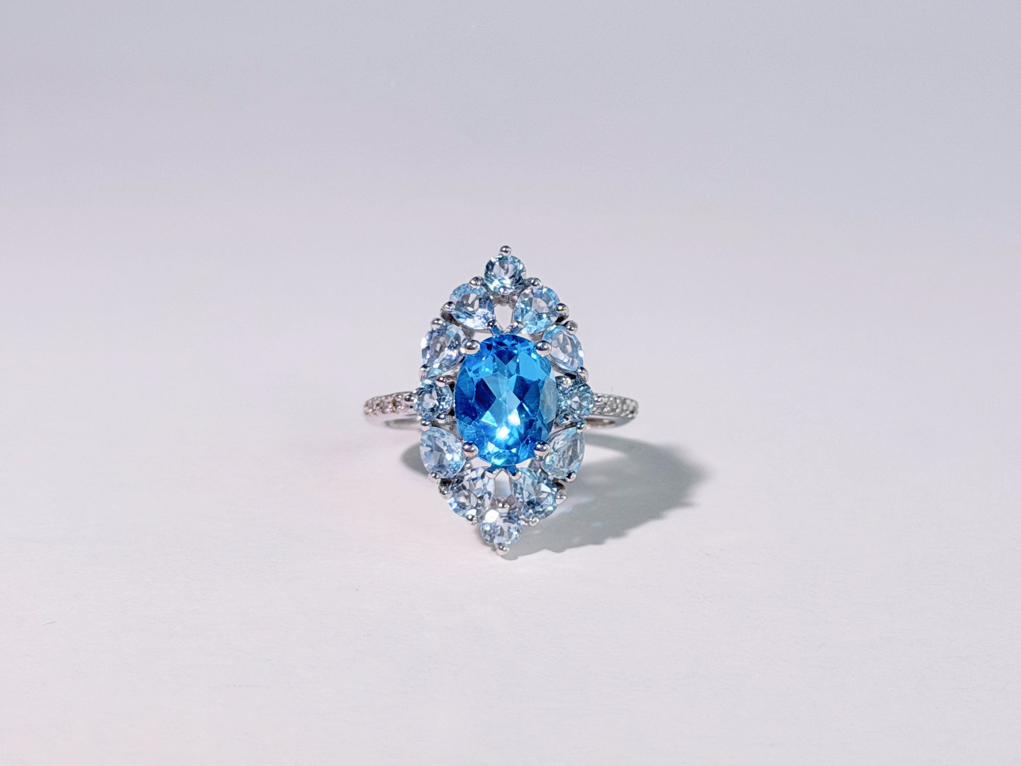 Iris of the Sea Topaz Ring